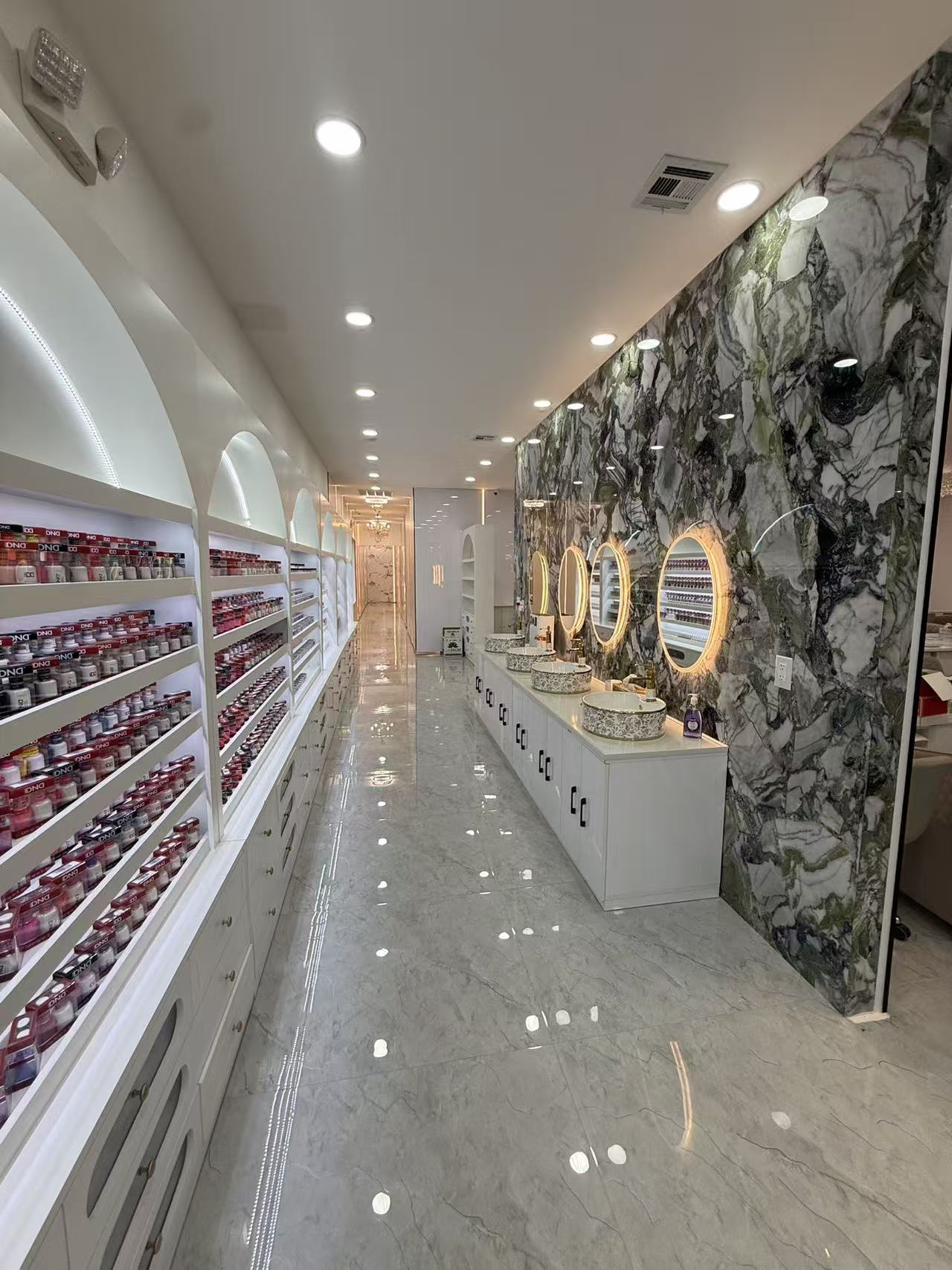 Nail polish display and manicure area at Eden Nail Spa